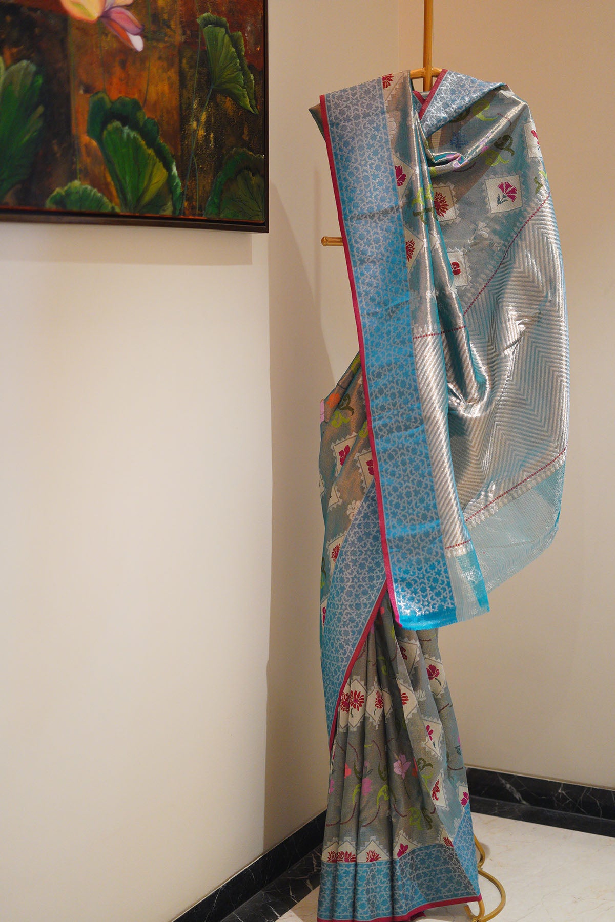 Bright sky blue with hues of red and a jaquard border
